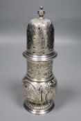 A late Victorian repousse silver sugar caster, embossed with fish, hounds and swan amid foliage,