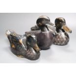 Three painted wood decoy ducks with glass inset eyes, one incised mark C. H., largest 29cm long