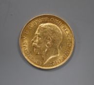 A George V 1911 gold half sovereign.