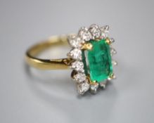 A modern 18ct gold, emerald and diamond rectangular cluster ring, size L, gross 5 grams.CONDITION: