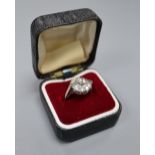 An Art Deco style 18ct white metal and diamond cluster ring, set with two rectangular and nine round