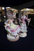 A late Meissen figure of a young girl with a spaniel and another of a young lady with a rose, 19th