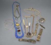 A lady's 9ct gold watch on a 9ct strap, a 9ct bar brooch, a 9ct ropetwist chain, a Regency