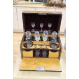A Victorian burr walnut cased decanter and drinking glass set, some of the glass matched, 40cm wide