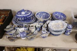 A group of 19th century blue and white pottery dishes, plates, jugs, together with an enamelled