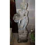 A reconstituted stone figure of a boy on plinth, height approx. 112cm, width approx. 34cm