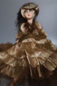 A painted felt and composition fashion doll, 75cm high with silk and taffeta dress