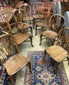A set of eight early 20th century elm and beech Windsor wheelback dining chairs, with crinoline