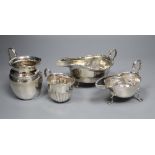 Two George V silver sauceboats and two earlier silver cream jugs, 9.5 oz.