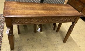 A Victorian Gothic style oak side table with drawer, width 111cm, depth 41cm, height 67cm (cut