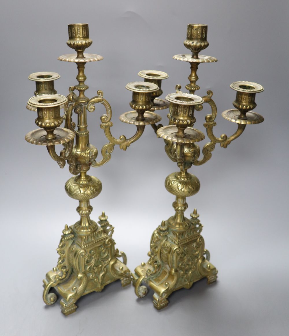 A pair of four light brass candelabra, height 41cm