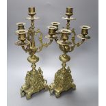 A pair of four light brass candelabra, height 41cm