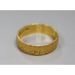 A 22ct textured gold wedding band, 5.5ct