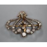 A Victorian yellow metal and diamond set scrolling pendant brooch, 29mm, gross 5 grams.