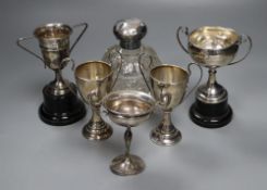 Five assorted small silver trophy cups, all with engraved inscriptions, tallest 12cm, and a silver