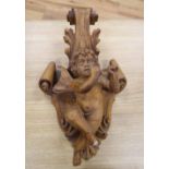 A Florentine style carved boxwood putti wall appliqué, height 53cm