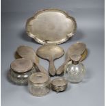 A matched George V silver mounted eight piece dressing table set.