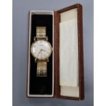 A Garrard 9ct gold-cased presentation wristwatch, with cream Arabic dial and subsidiary seconds,