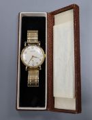 A Garrard 9ct gold-cased presentation wristwatch, with cream Arabic dial and subsidiary seconds,