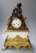 A 19th century bronze, ormulu and white marble mantel clock, with seated male surmounted, French