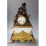 A 19th century bronze, ormulu and white marble mantel clock, with seated male surmounted, French