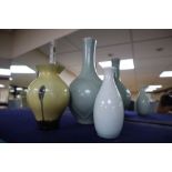 An Oriental celadon bottle vase, a smaller bottle vase and an Art glass vase, tallest 26.5cm
