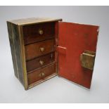 A brass money bank in the form of a safe, four drawers enclosed, height 21cm