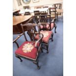 Three George III carved mahogany elbow chairs