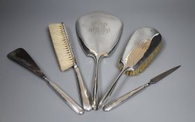 Five sterling mounted dressing table items, including hand mirror, brushes, shoe horn etc.