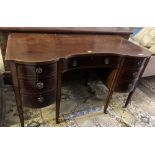 An Edwardian mahogany kneehole dressing table, width 128cm, depth 64cm, height 75cm