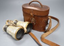 A pair of silver mounted Negretti and Zambra opera glasses, in original leather case