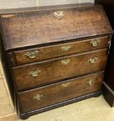 A mid 18th century oak bureau with well, width 92cm, depth 46cm, height 99cm