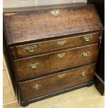 A mid 18th century oak bureau with well, width 92cm, depth 46cm, height 99cm