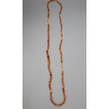 A single strand graduated oval amber bead necklace, 108cm, gross 18 grams.