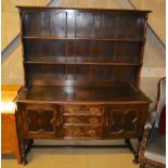 A 1920's Jacobean revival dresser, width 152.5cm, depth 49.5cm, height 188.5cm