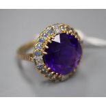 An 18ct yellow gold, amethyst, sapphire and diamond dress ring, with claw-set basket mount, size