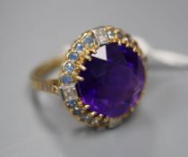 An 18ct yellow gold, amethyst, sapphire and diamond dress ring, with claw-set basket mount, size