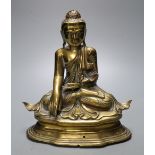 A 19th century Chinese bronze seated figure of Buddha Shakyamuni, seated on plinth, height 21cm