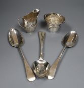 A late Victorian silver half fluted cream jug, a George V Arts & Crafts silver cream jug by
