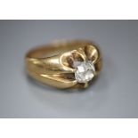 An early 20th century yellow metal and claw set solitaire diamond ring, size N, gross 7.1 grams, the