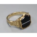 A late Victorian yellow metal and shield shaped banded agate set signet ring, size P/Q, gross 3.4