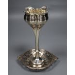 An Edwardian silver tulip vase, 18.1cm, weighted and a small silver bonbon dish.