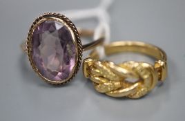 A gold 'knot' ring (marks rubbed but tests as 18ct), 5 grams, and a 9ct gold and amethyst ring,