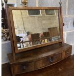 A Regency mahogany bow front toilet mirror, width 65cm, height 63cm