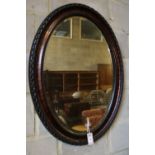 An early 20th century oval wall mirror, height 88cm