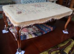 A Victorian carved walnut dressing stool, with tapestry seat, width 96cm depth 60cm, height 43cm