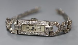 A lady's Art Deco white metal (stamped All Plat) and diamond set cocktail watch, on flexible white