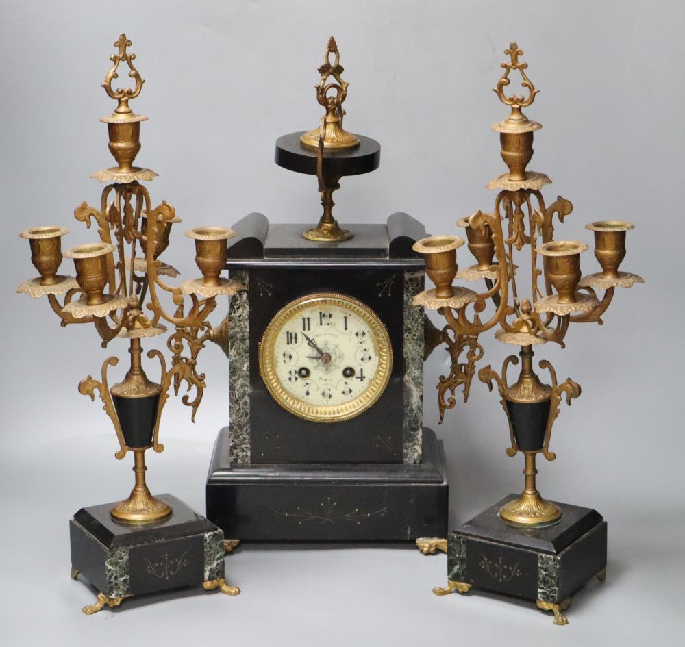 A 19th century black slate clock garniture