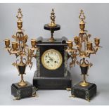 A 19th century black slate clock garniture