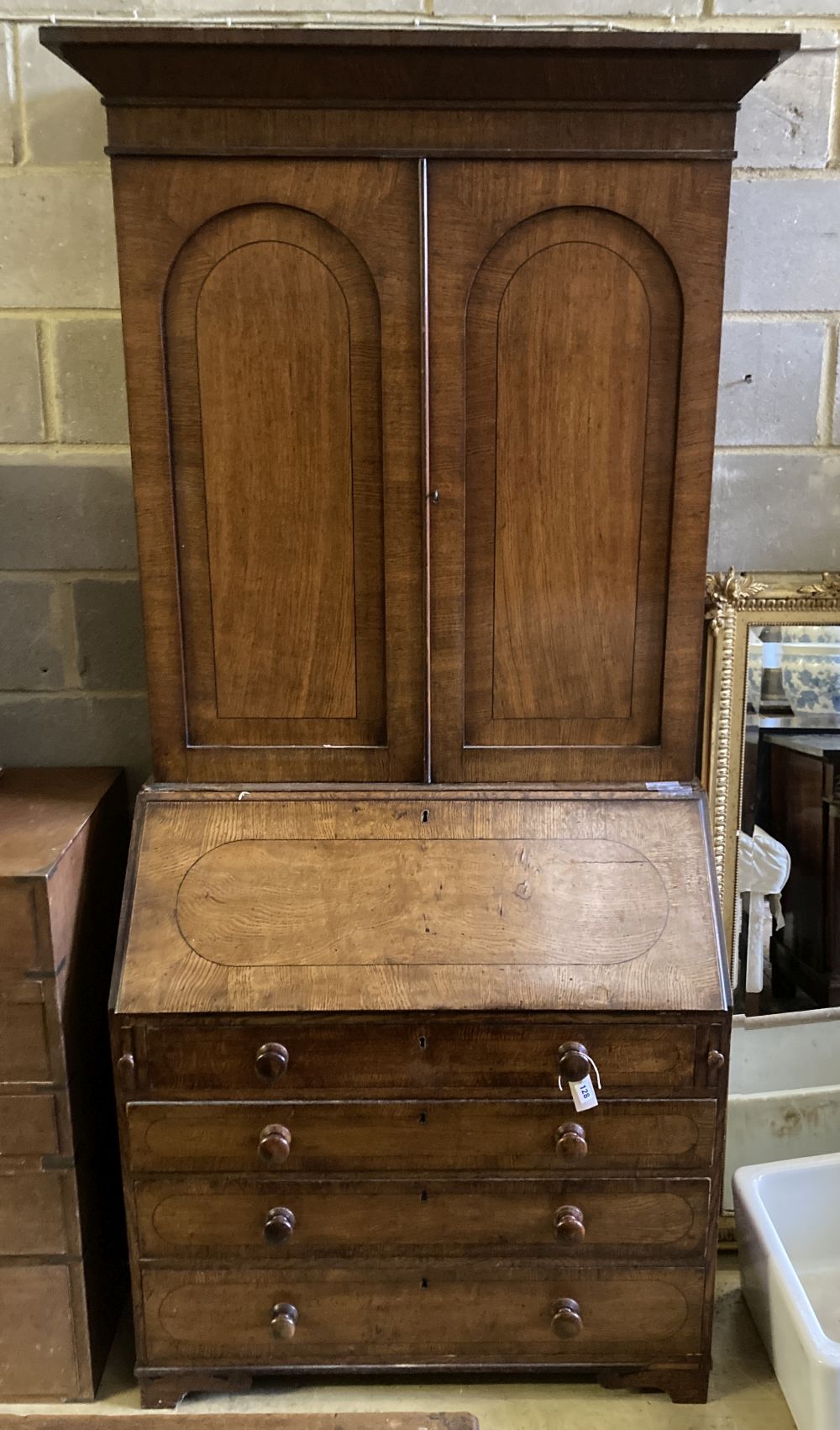 A George III oak bureau bookcase, width 98cm, depth 52cm, height 219cm